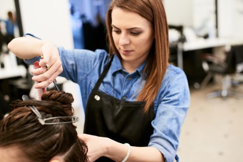 trained cosmetologist working