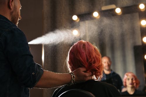 model getting hair styled