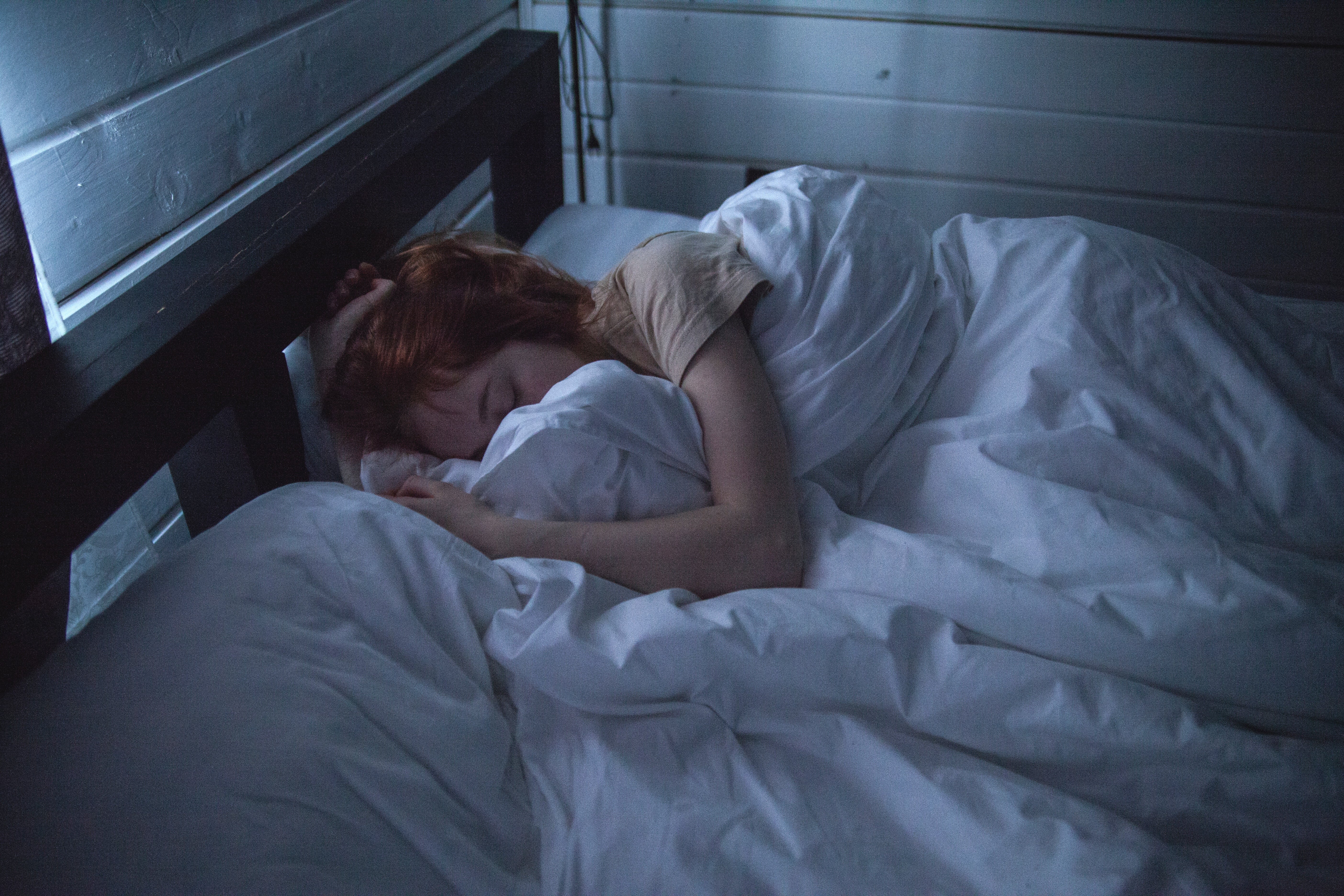 Woman sleeping in her bed.